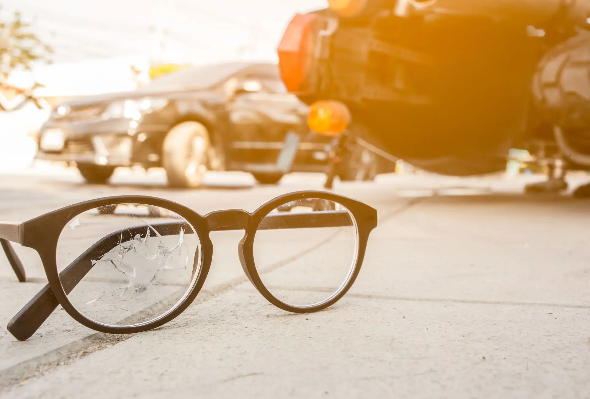 the glasses of a car accident victim on the ground